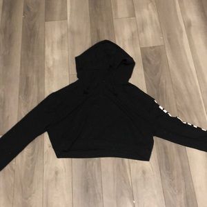 Black/white croptop and says killing it on sleeve